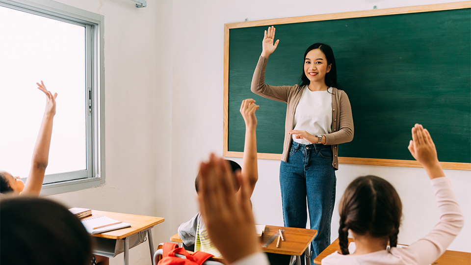 teacher-gestures-hand-raise